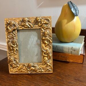 Vintage Cherub Gold-tone resin frame with cherubs playing musical instruments